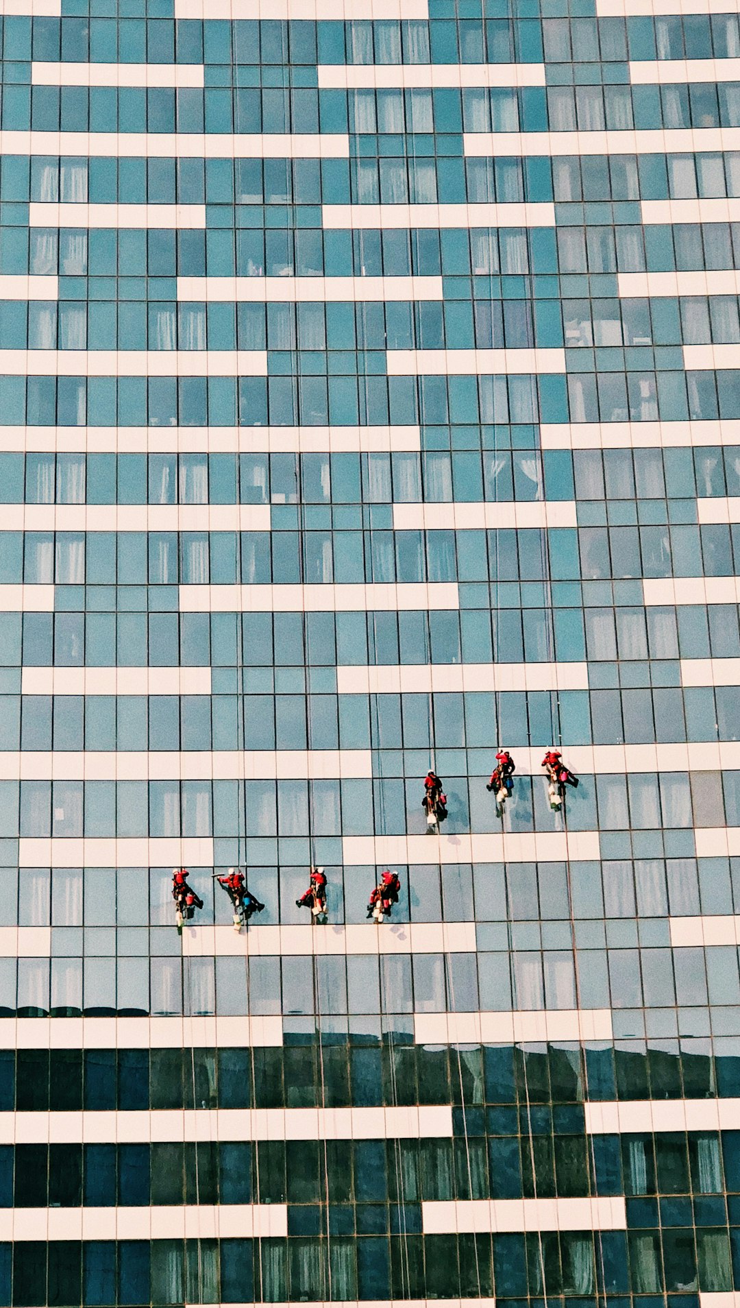 people-walking-on-blue-and-white-concrete-building-during-daytime-chuptij-wp0